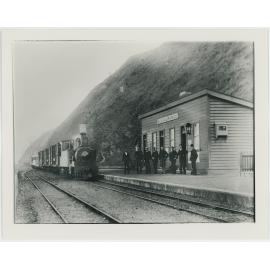 Men in front of train at Ngahauranga [Ngauranga] Railway Station