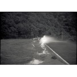 Photograph of water blowing over lower Karori dam during the Wahine storm