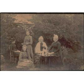 Unidentified photograph of a group of women having tea in the garden
