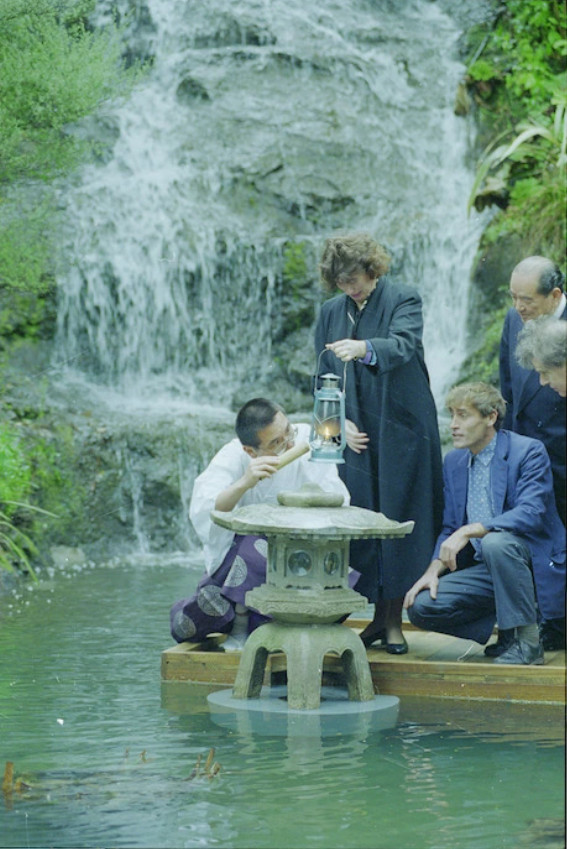 Hiroshima Peace flame at its site in the Botanic Garden, Wellington, New Zealand. Those grouped around the stone lantern are (from left): Mamoru Niwa (Shinto Priest); Fran Wilde (Mayor of Wellington); and Peter Kundycki (landcscape architect, Wellington City Council). Photographed by and Evening Post staff photographer 27 June 1994.

Citation
National Library New Zealand, EP/1994/1942/17-F
